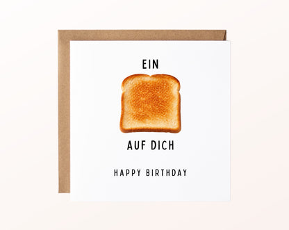 Geburtstagskarte „Ein Toast auf Dich“ mit fotorealistischem Toastmotiv und Kraftpapierumschlag