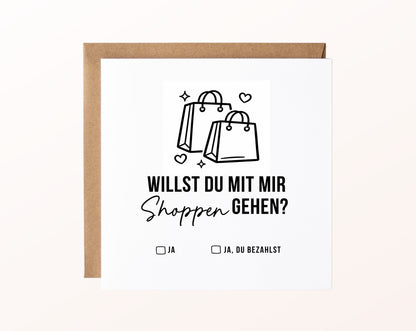 Gutscheinkarte „Shoppen gehen“ mit Einkaufstaschen und Kraftpapierumschlag