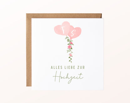 Hochzeitskarte mit rosa Herzballons, weißen Initialen F und S und Blumengirlande